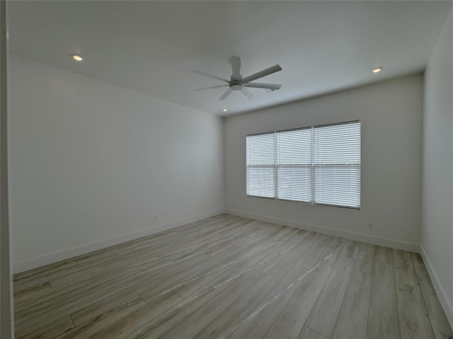 spare room with recessed lighting, baseboards, ceiling fan, and light wood-type flooring