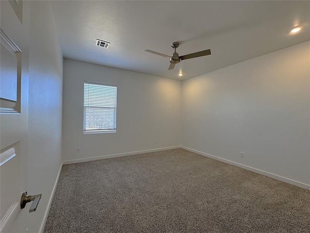empty room with visible vents, carpet flooring, baseboards, recessed lighting, and a ceiling fan
