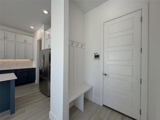 mudroom featuring recessed lighting and light wood finished floors
