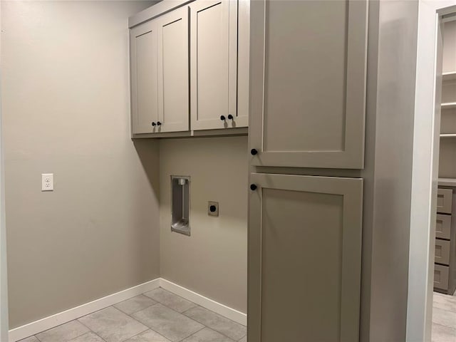 4129 Sambar St, Tuttle, OK 73089 - laundry room featuring electric dryer hookup and cabinet space