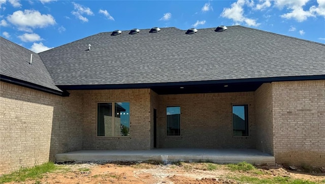4129 Sambar St, Tuttle, OK 73089 - rear view of house featuring a patio area, a shingled roof, and brick siding