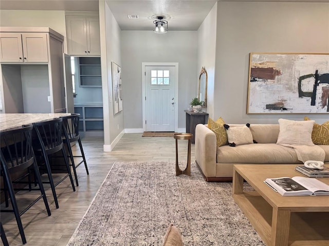 4129 Sambar St, Tuttle, OK 73089 - living area with light wood-style flooring and baseboards