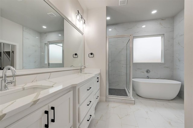 bathroom with a sink, a marble finish shower, plenty of natural light, and marble finish floor