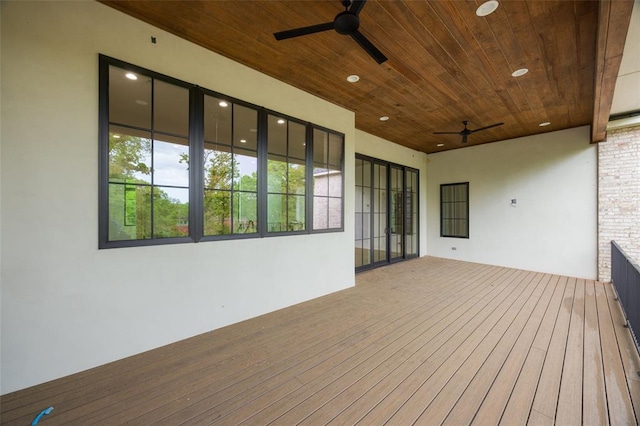 wooden deck featuring a ceiling fan