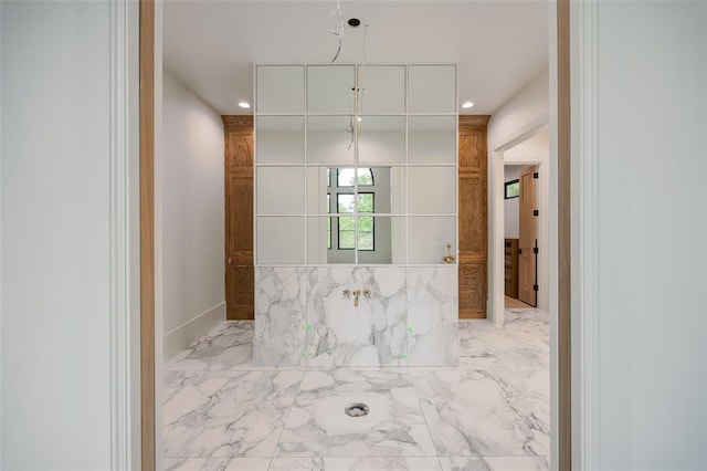 bathroom with recessed lighting and marble finish floor