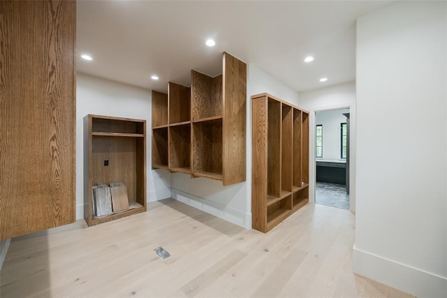 mudroom with recessed lighting, baseboards, and light wood-style floors