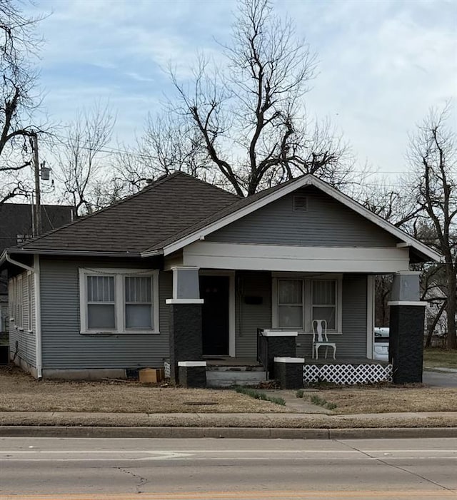224 E Ayers St, Edmond, OK 73034 - bungalow with covered porch and roof with shingles