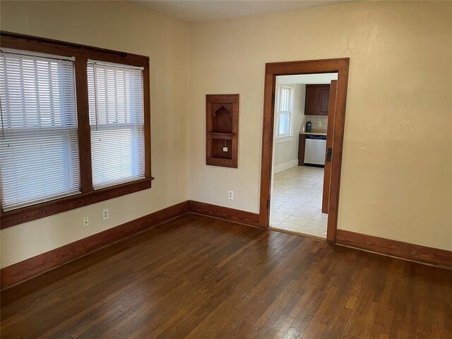 224 E Ayers St, Edmond, OK 73034 - spare room with hardwood / wood-style flooring and baseboards