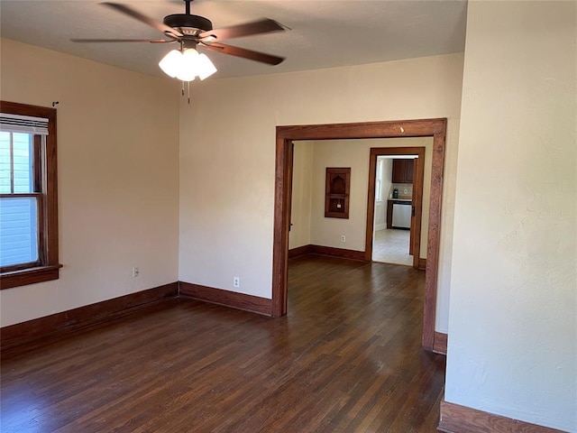 224 E Ayers St, Edmond, OK 73034 - unfurnished room featuring a ceiling fan, baseboards, and dark wood finished floors