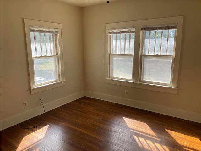 224 E Ayers St, Edmond, OK 73034 - empty room featuring baseboards and dark wood-type flooring