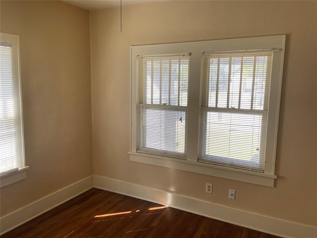 224 E Ayers St, Edmond, OK 73034 - unfurnished room with dark wood finished floors and baseboards