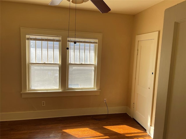 224 E Ayers St, Edmond, OK 73034 - unfurnished room with a ceiling fan, dark wood-style flooring, and baseboards