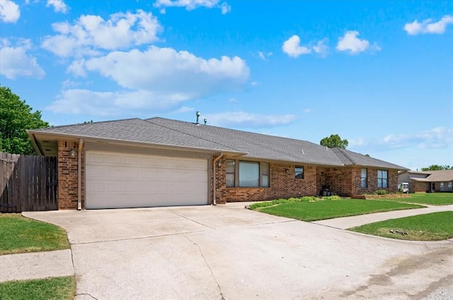 ranch-style house with brick siding, an attached garage, fence, and driveway