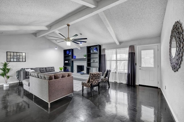 living area with a ceiling fan, a textured ceiling, baseboards, and finished concrete flooring