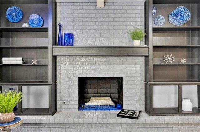 interior details with a brick fireplace