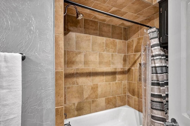 bathroom with shower / bathtub combination with curtain