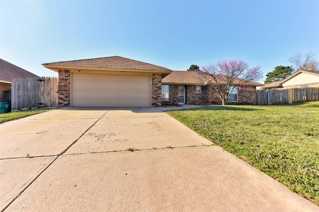 single story home with a front yard, brick siding, fence, concrete driveway, and an attached garage