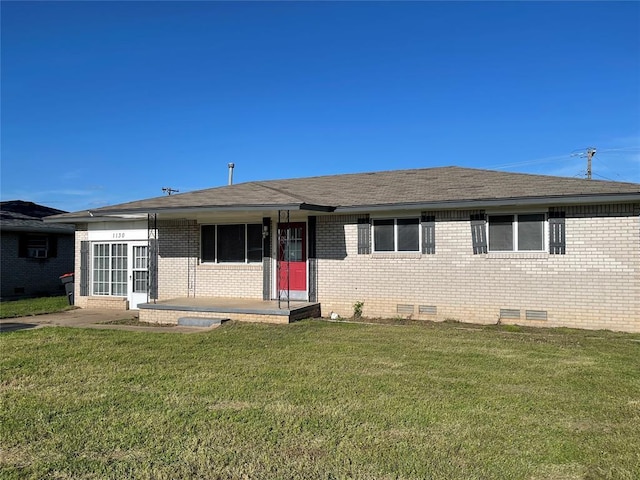 single story home with brick siding, roof with shingles, a front yard, and crawl space