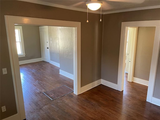 230 E Ayers St, Edmond, OK 73034 - unfurnished room featuring dark wood-style flooring, ceiling fan, crown molding, and baseboards