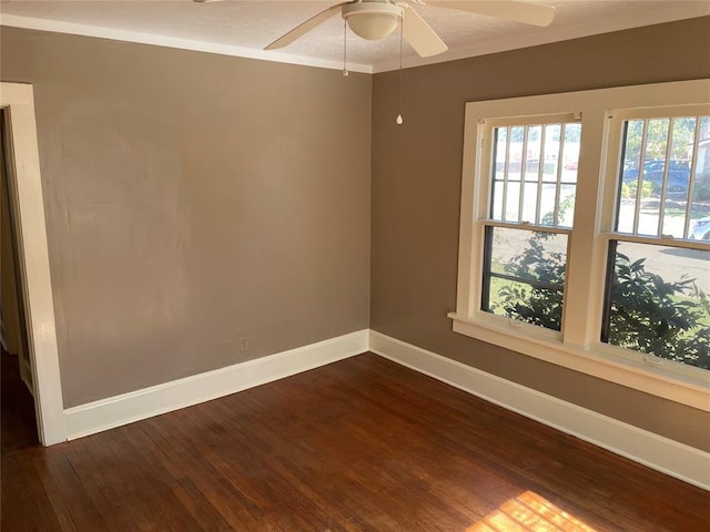 230 E Ayers St, Edmond, OK 73034 - unfurnished room featuring baseboards, ornamental molding, ceiling fan, and dark wood-style floors