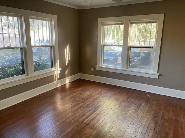 230 E Ayers St, Edmond, OK 73034 - empty room with a wealth of natural light, dark wood finished floors, and baseboards