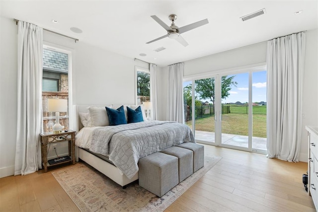 bedroom with a ceiling fan, visible vents, access to outside, and light wood-style floors