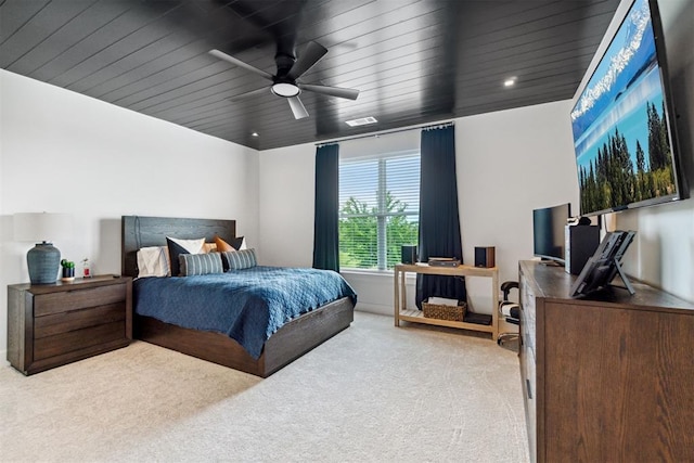 bedroom with carpet, ceiling fan, and visible vents