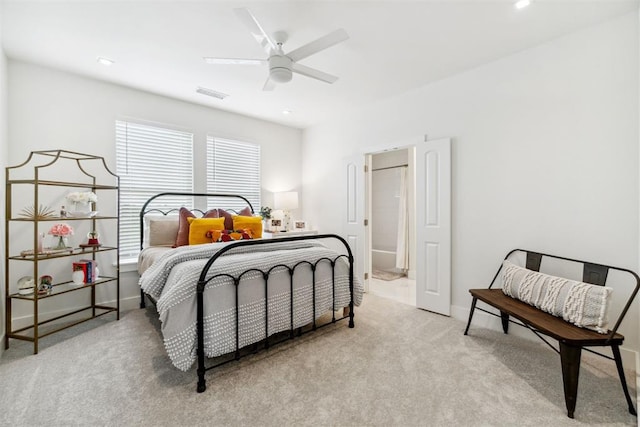 bedroom with visible vents, a ceiling fan, and carpet