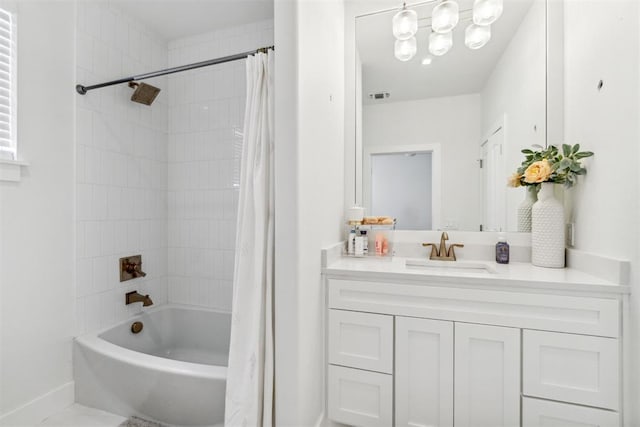 full bathroom with visible vents, shower / tub combo, and vanity