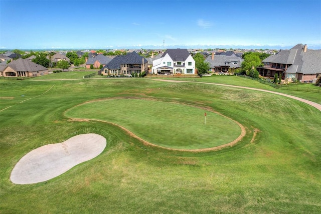 drone / aerial view featuring a residential view and view of golf course