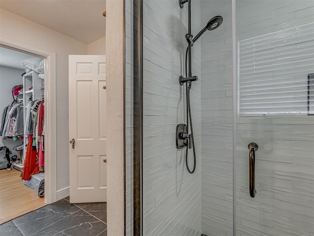 bathroom featuring a shower stall