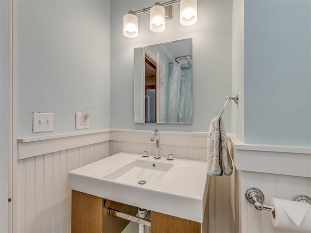 bathroom featuring a wainscoted wall