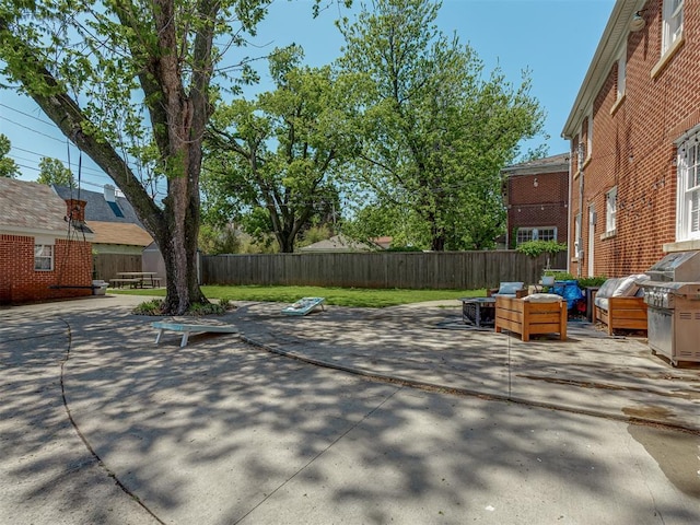 view of patio / terrace featuring an outdoor living space and a fenced backyard