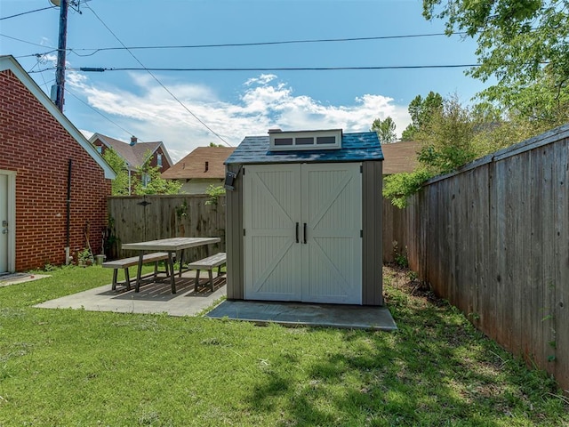 view of shed featuring a fenced backyard