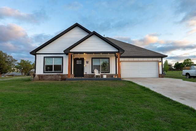 view of front facade featuring driveway, board and batten siding, roof with shingles, a front yard, and a garage