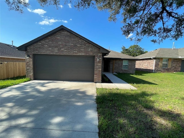 single story home with fence, a front lawn, brick siding, a garage, and driveway