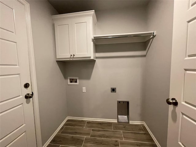 clothes washing area featuring washer hookup, wood tiled floor, electric dryer hookup, cabinet space, and baseboards