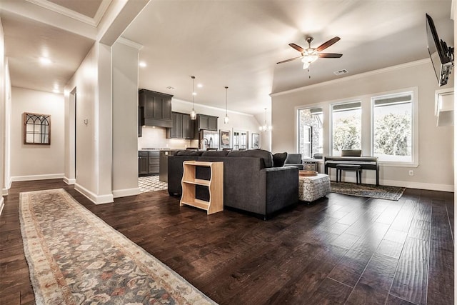 living room featuring recessed lighting, ornamental molding, baseboards, a ceiling fan, and dark wood-type flooring