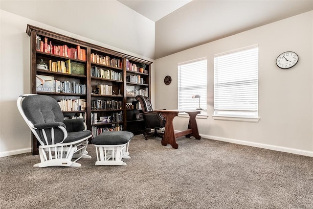 sitting room featuring baseboards, lofted ceiling, and carpet flooring