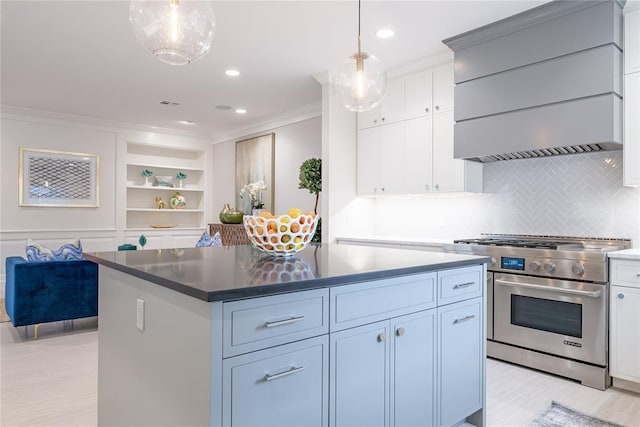 1421 Glenbrook Ter, Nichols Hills, OK 73116 - kitchen with tasteful backsplash, white cabinetry, high end stainless steel range, ornamental molding, and wall chimney exhaust hood