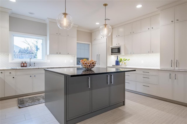 1421 Glenbrook Ter, Nichols Hills, OK 73116 - kitchen featuring built in appliances, tasteful backsplash, a kitchen island, and recessed lighting