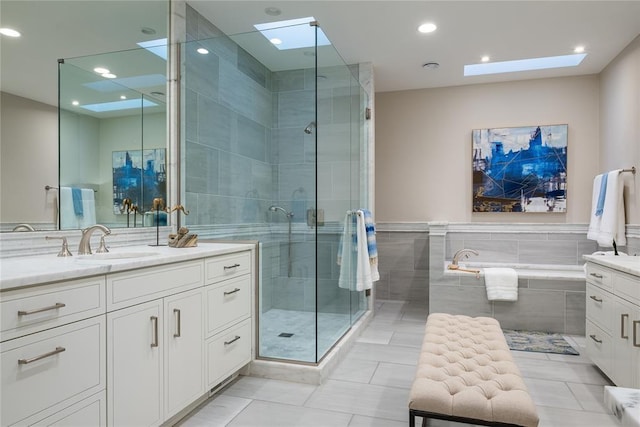 1421 Glenbrook Ter, Nichols Hills, OK 73116 - full bathroom featuring vanity, a skylight, and a stall shower