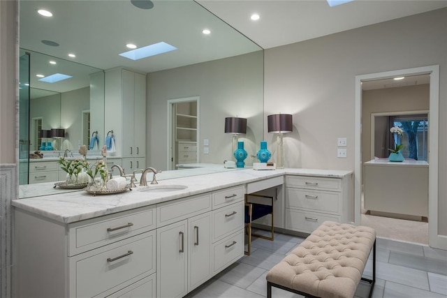 1421 Glenbrook Ter, Nichols Hills, OK 73116 - bathroom with recessed lighting, a skylight, tile patterned flooring, and vanity