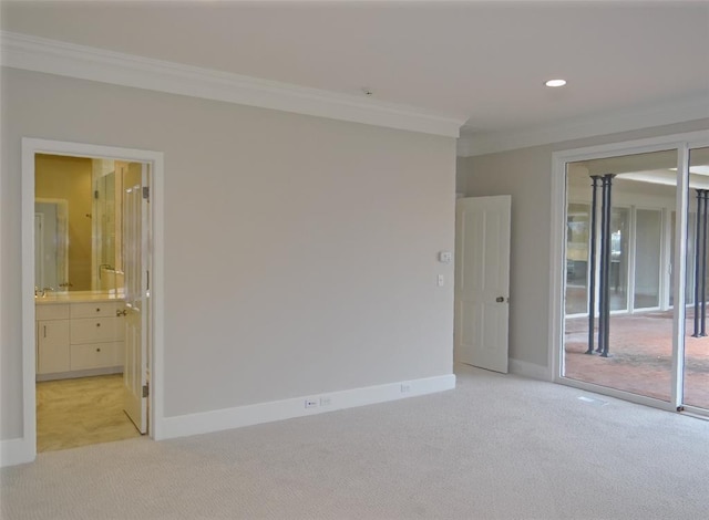 1421 Glenbrook Ter, Nichols Hills, OK 73116 - spare room featuring crown molding, recessed lighting, baseboards, and light colored carpet
