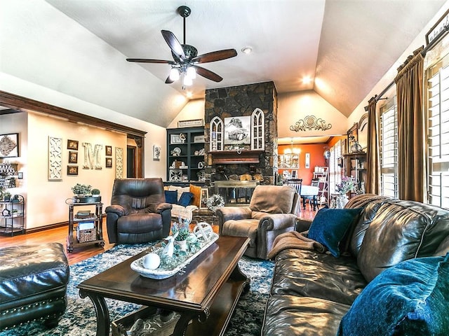 living room with a ceiling fan, baseboards, wood finished floors, and lofted ceiling