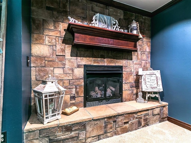 interior details with crown molding, baseboards, carpet floors, and a fireplace