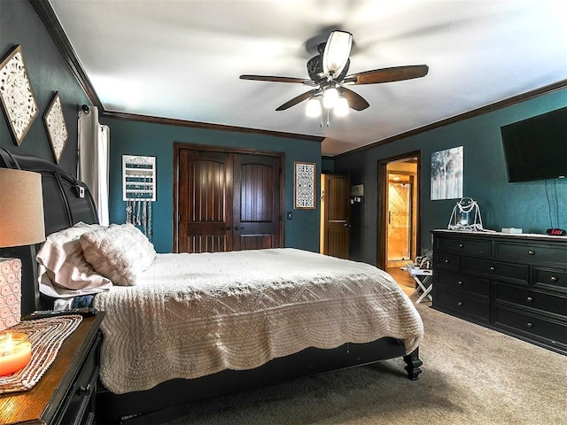 bedroom featuring carpet floors, ceiling fan, ornamental molding, and connected bathroom