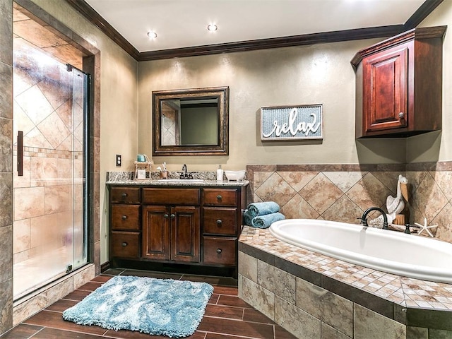full bath featuring wood tiled floor, a garden tub, a stall shower, vanity, and ornamental molding