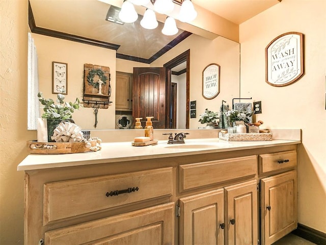 bathroom featuring vanity and ornamental molding