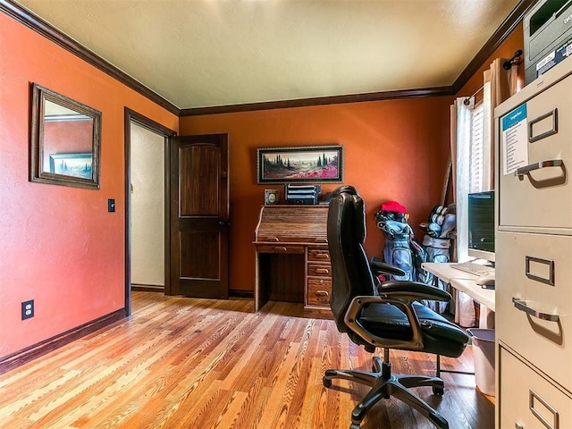 office with baseboards, ornamental molding, a textured wall, and wood finished floors